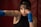 a woman with a boxing glove on her shoulder