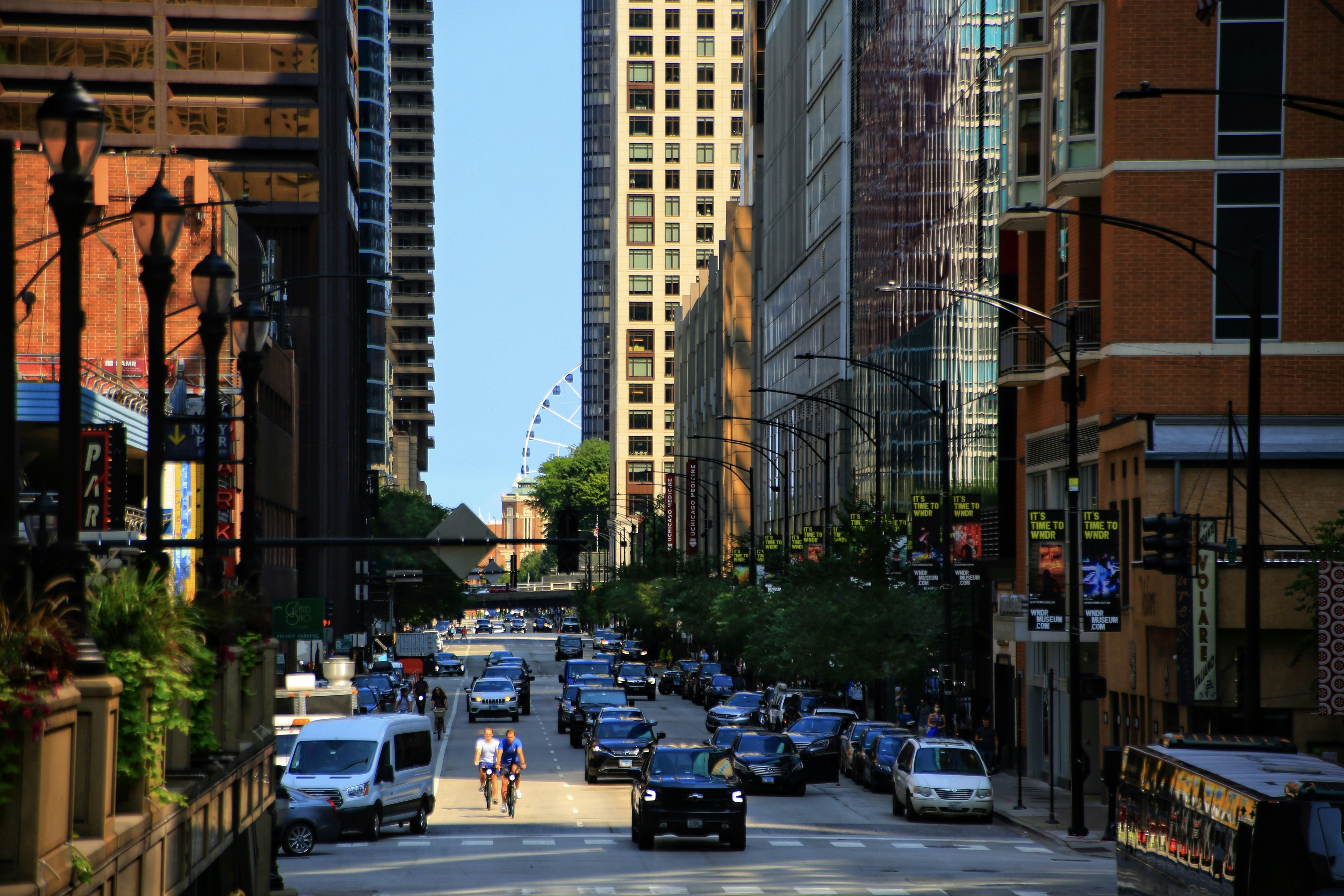 A vibrant Chicago neighborhood street scene like in Uptown or the West Loop. - short term leases chicago