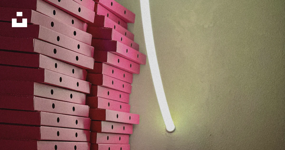Pink Shelf Box A stack of pink boxes sitting on top of a wooden shelf photo β Free ...