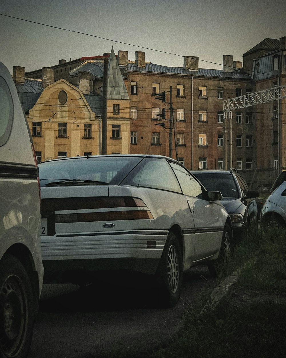 a group of cars parked on the side of a road