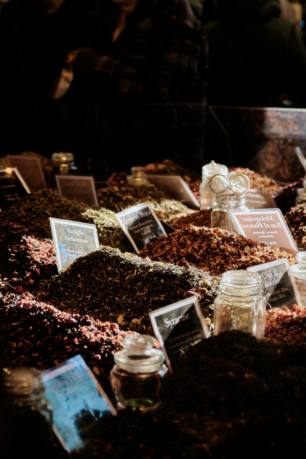 a display case filled with lots of different types of spices