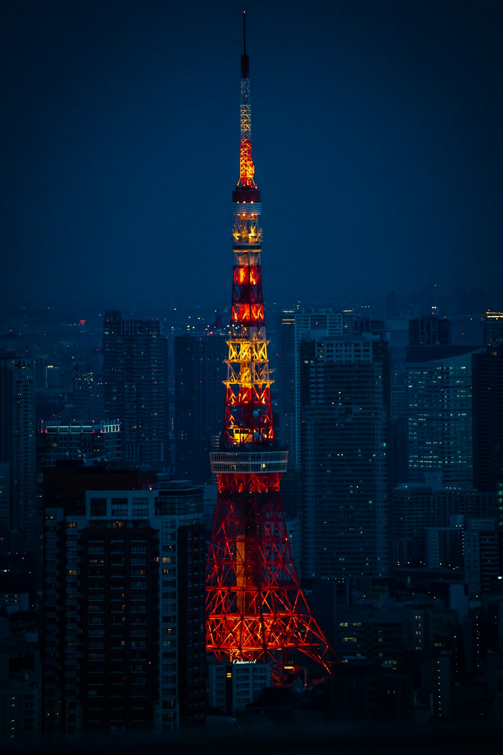 the eiffel tower lit up in red and yellow