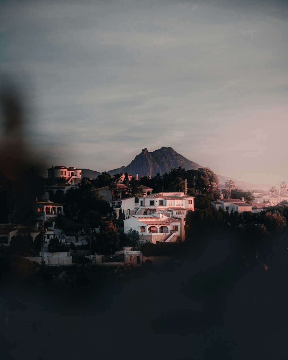 a view of a city with a mountain in the background