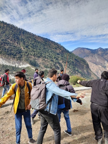 A group of people enjoying outdoor activities with their backpacks.