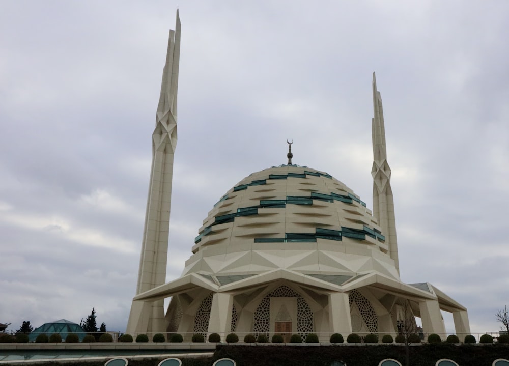 a large white building with two tall towers