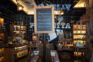 A cozy tasting room with bottles of wine and pisco displayed invitingly.