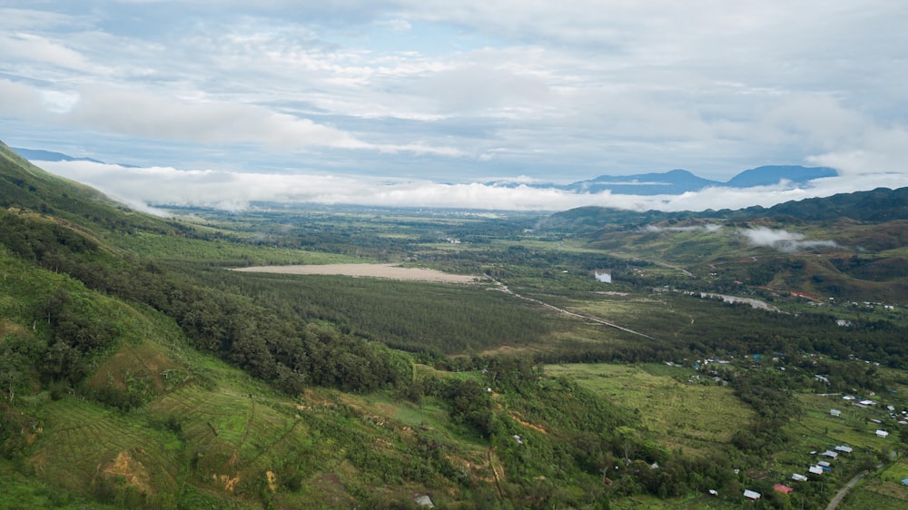 a scenic view of a valley with a river running through it