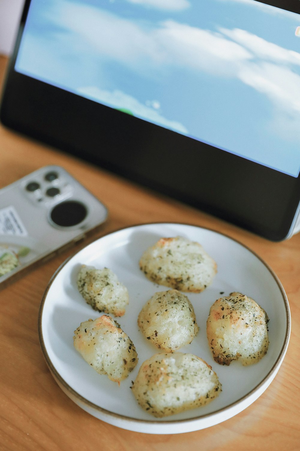 a plate of food next to a remote control
