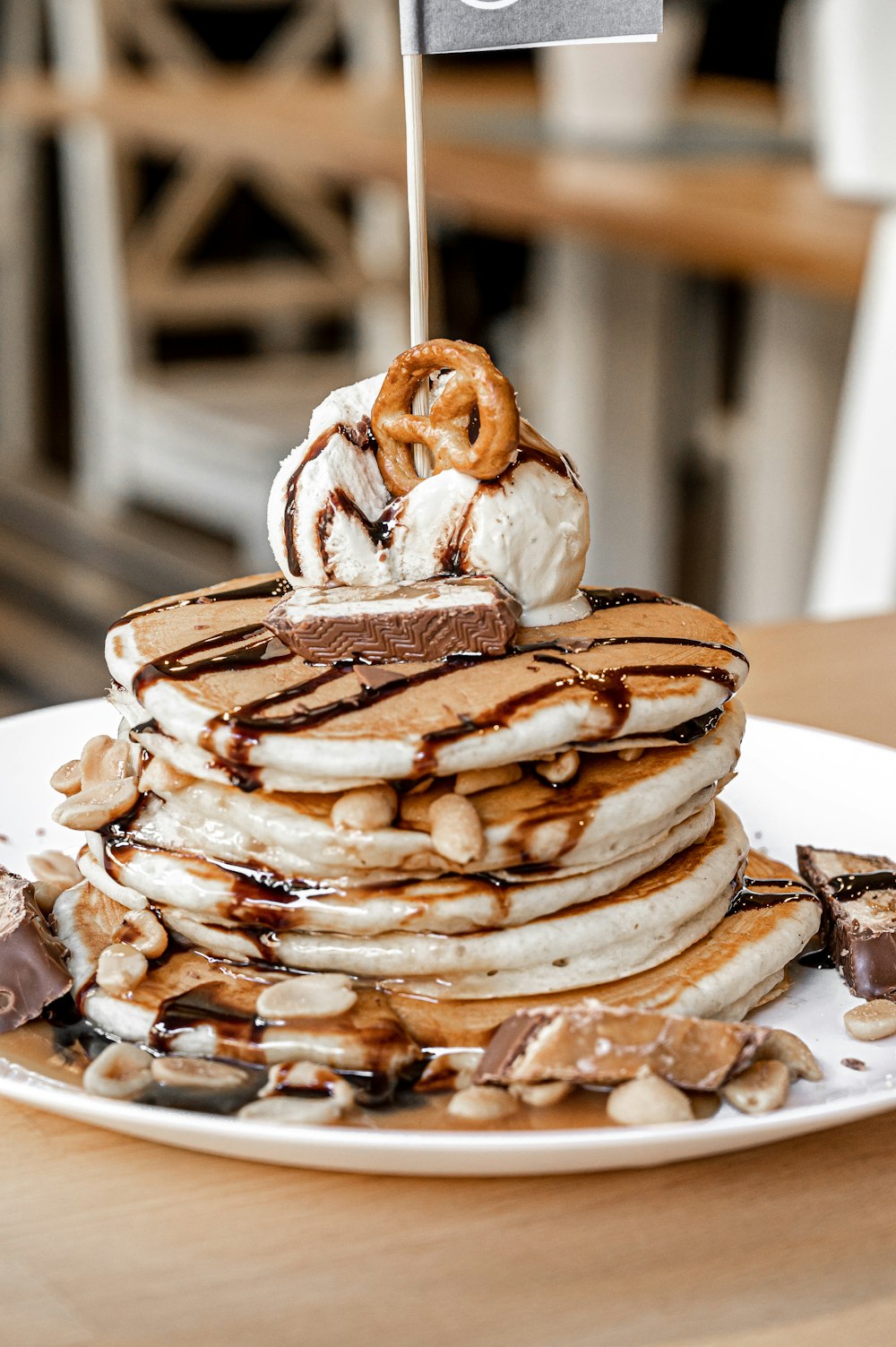 a stack of pancakes with a flag on top of it