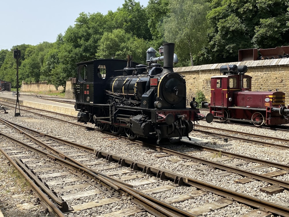 an old fashioned train is on the tracks