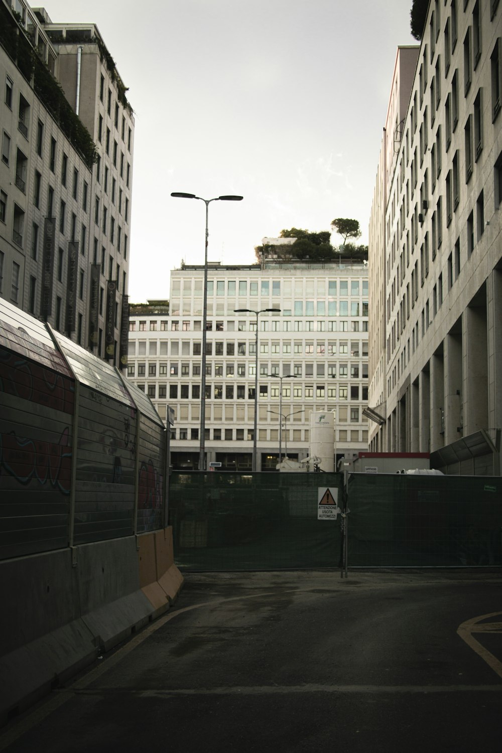 a city street with tall buildings in the background