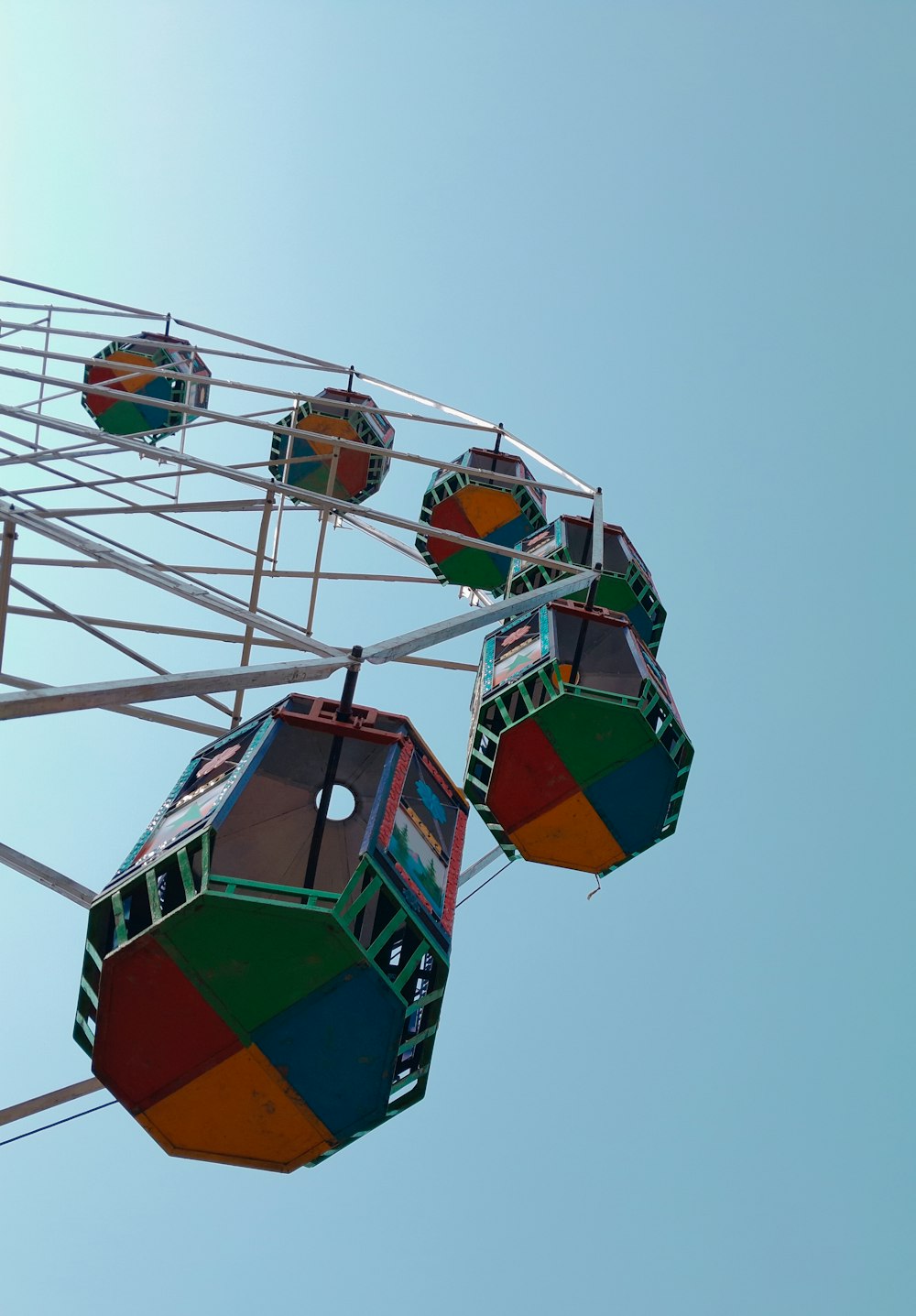 a ferris wheel with four seats in the sky
