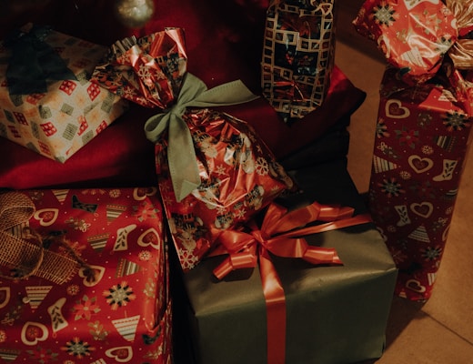 a pile of wrapped presents sitting next to each other