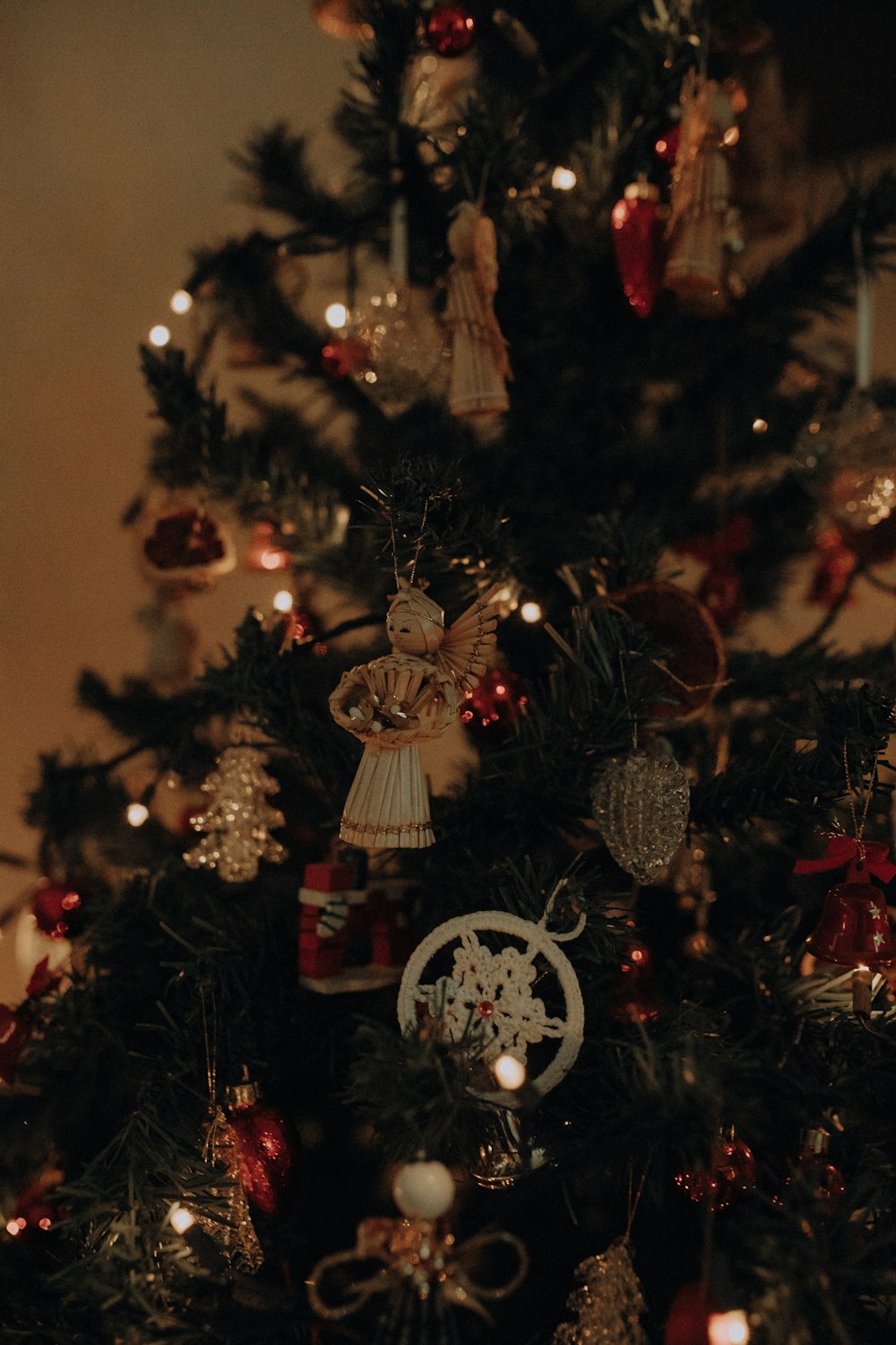 a small christmas tree with ornaments on it