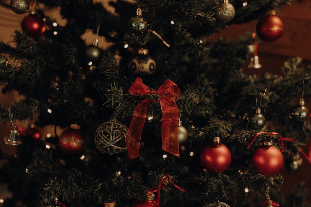 a close up of a christmas tree with ornaments