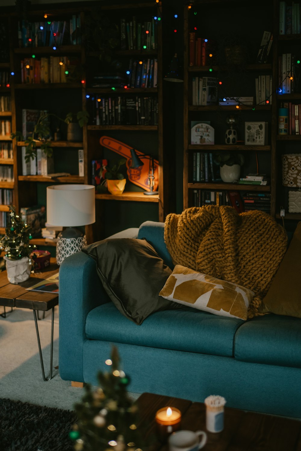 a living room filled with furniture and a christmas tree