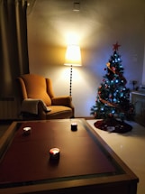 A cozy living room with lit candles on a table.