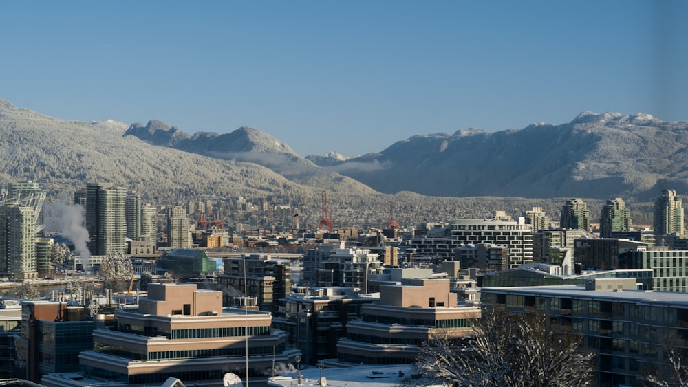 a view of a city with mountains in the background