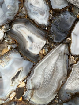 Close-up of a polished luxury agate desktop decor piece with rich natural patterns.