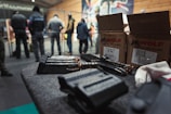 Close-up of tactical gear and ammunition neatly arranged on a table.