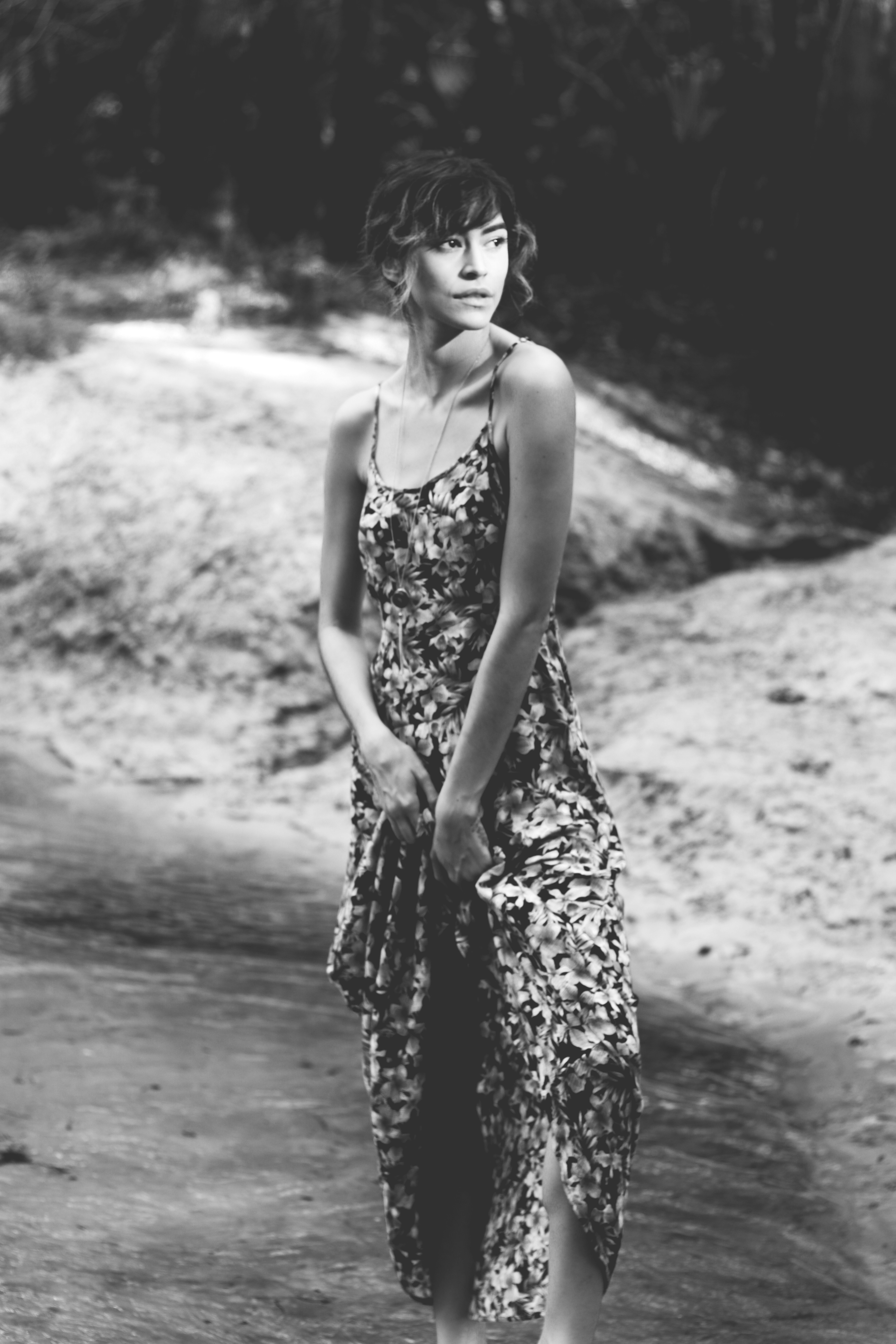 A woman in a dress standing on a beach photo – Free Fl Image on Unsplash