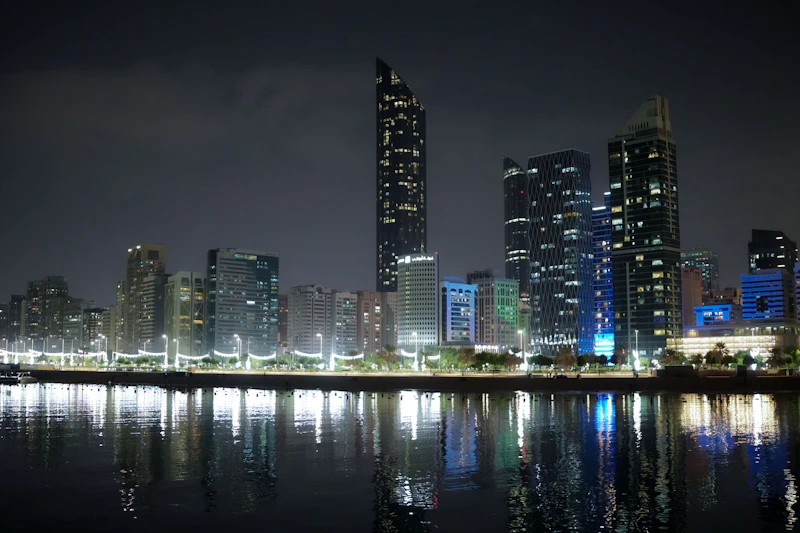 Abu Dhabi lights reflecting in the water at night