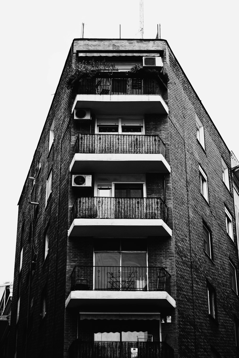 a tall brick building with balconies and balconies