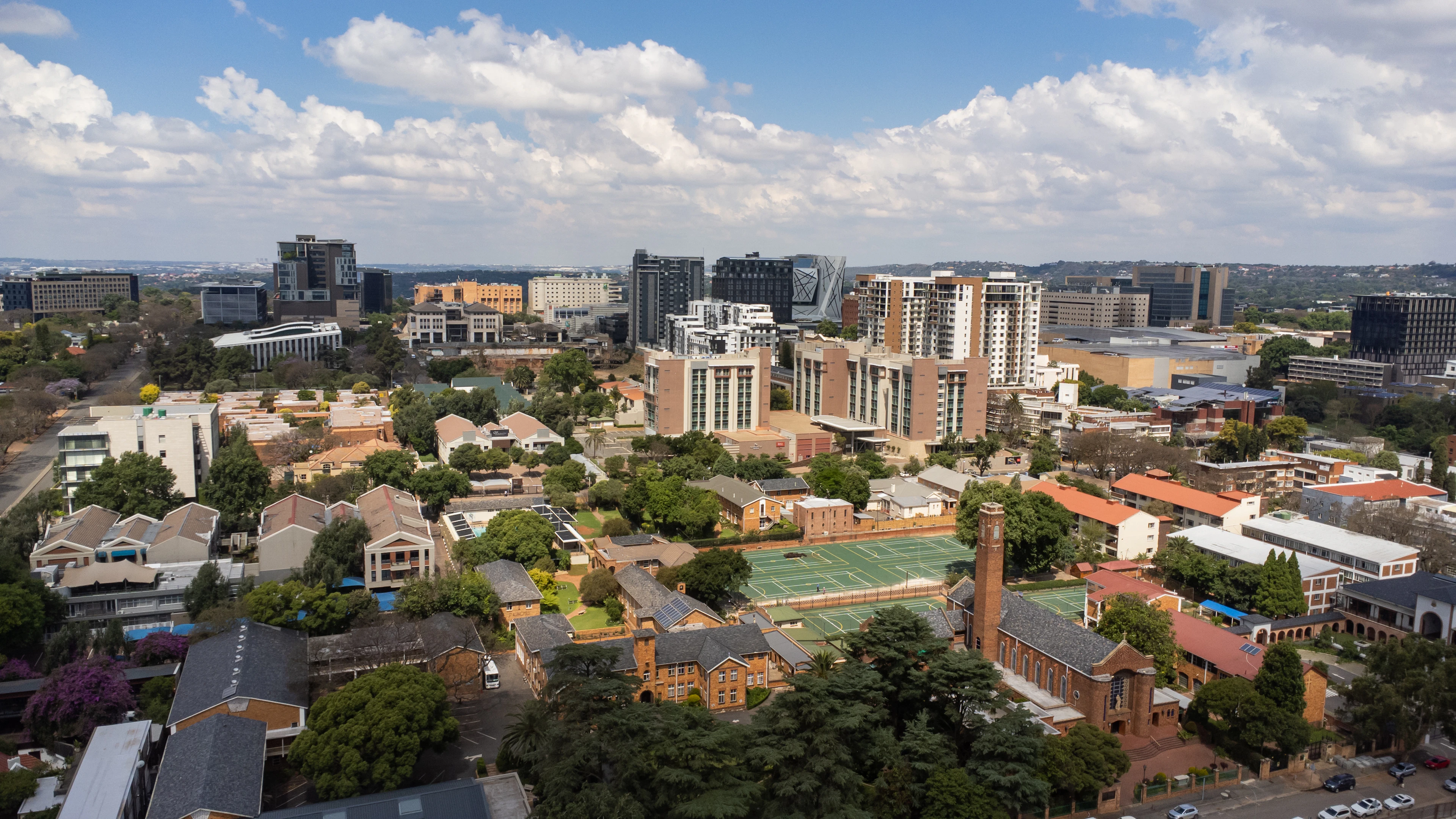 Johannesburg's northern suburbs from above, green between the low buildings