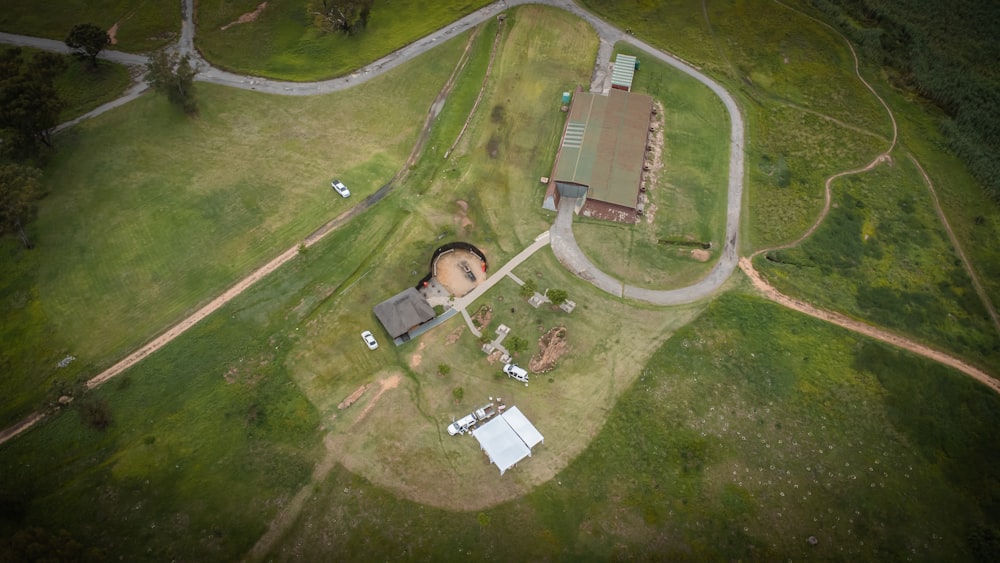 an aerial view of an old farm house