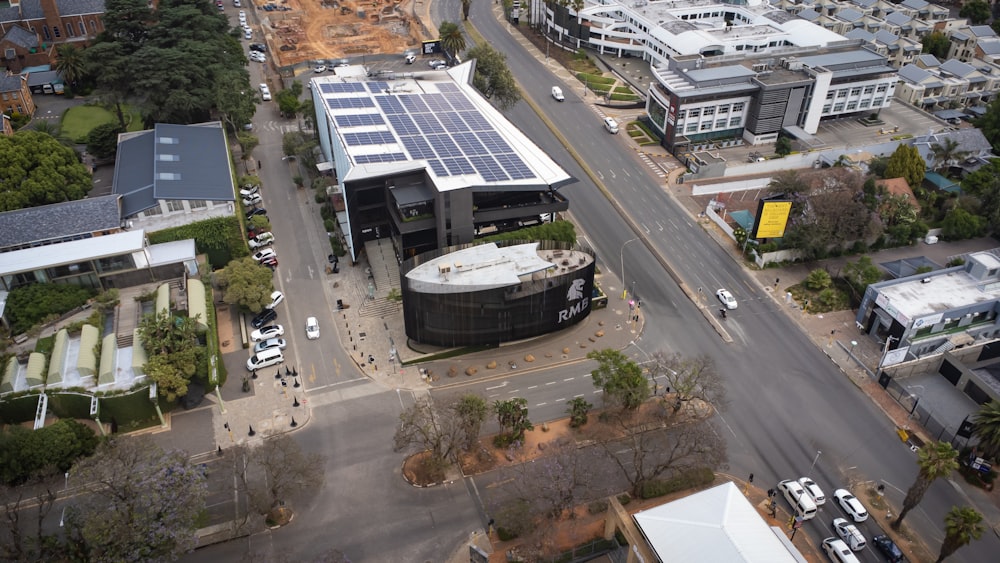 an aerial view of a city with a solar panel on the roof