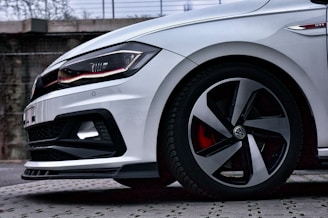 Volkswagen Golf GTI in motion, showcasing its sporty silhouette.