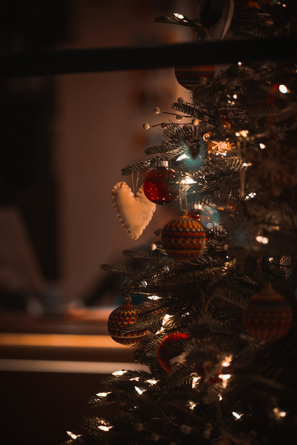 a close up of a christmas tree with ornaments