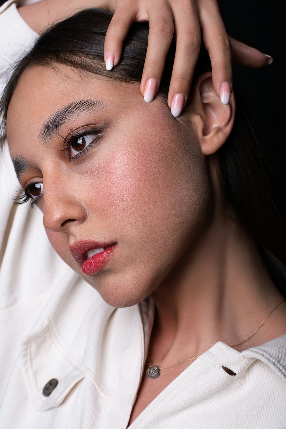 a close up of a person wearing a white shirt