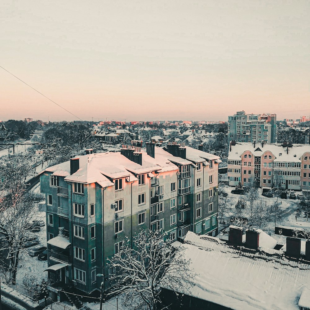 a view of a snowy city from a high rise building