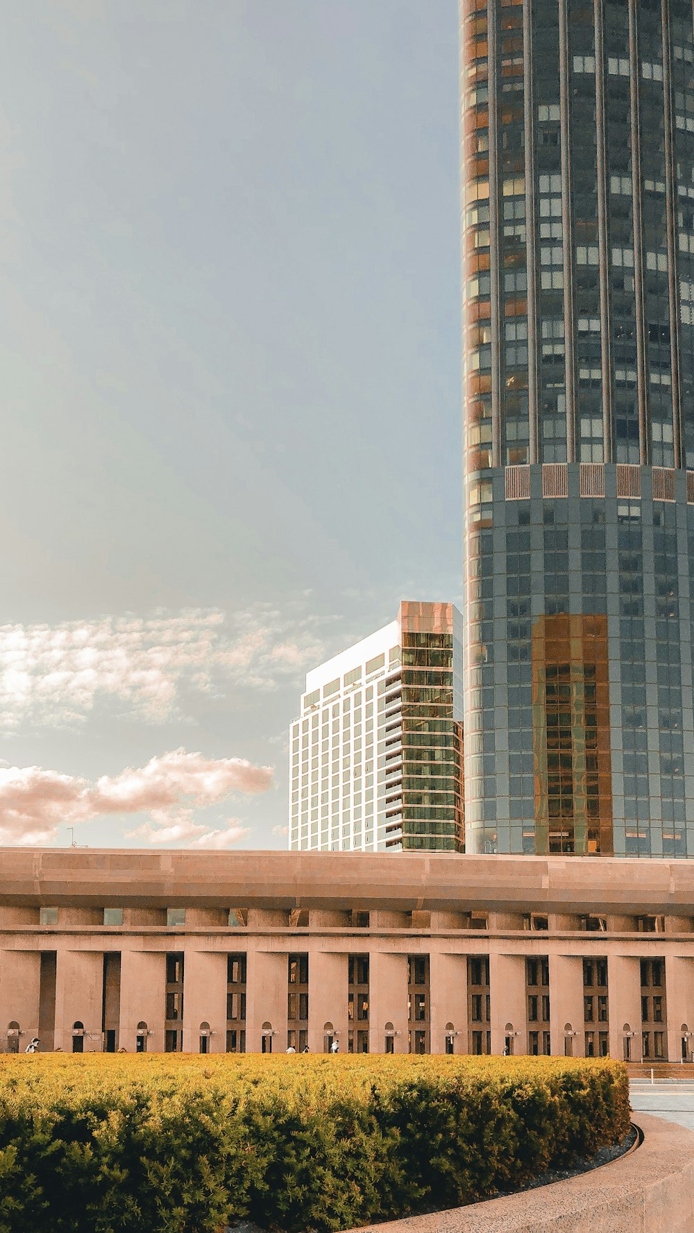 a tall building with a clock tower in the background