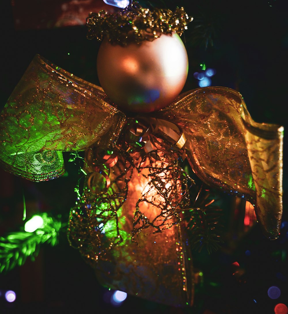 a close up of a christmas ornament on a tree