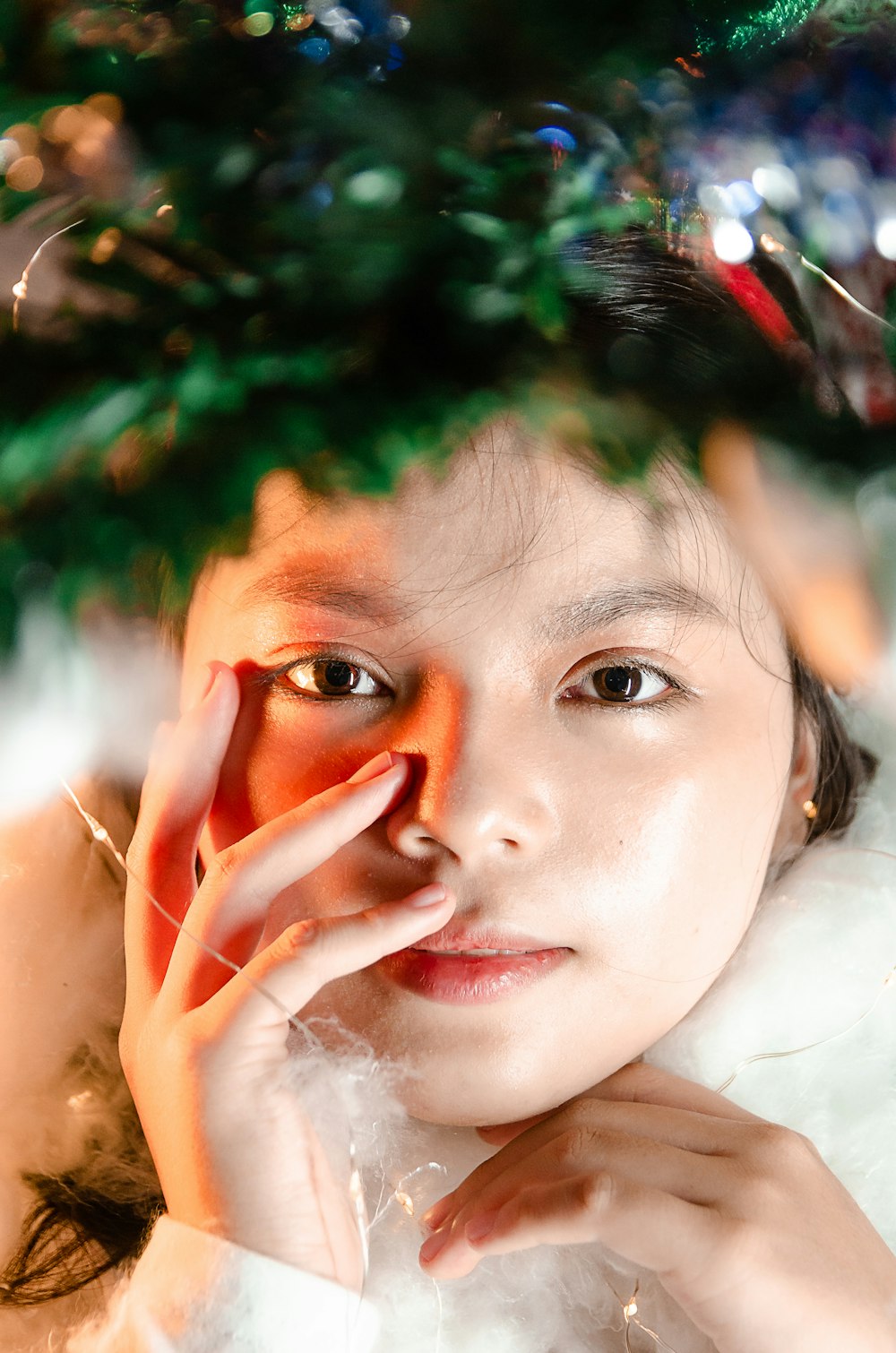 a woman with a christmas tree on her head