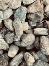 Close-up of crushed stones piled high at a local stone crusher yard.