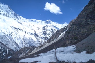A breathtaking landscape featuring mountains and a clear blue sky.