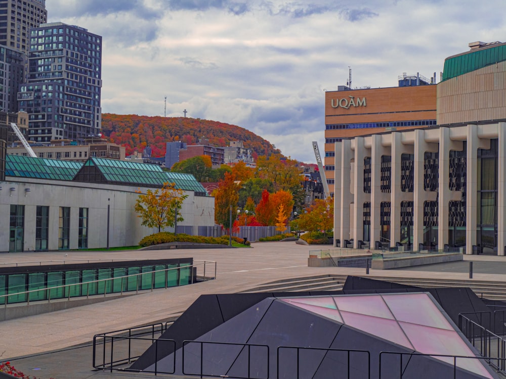 a view of a city street with buildings in the background