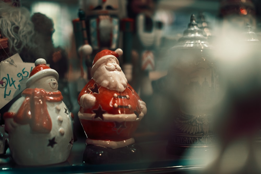 a close up of a santa clause figurine on a shelf