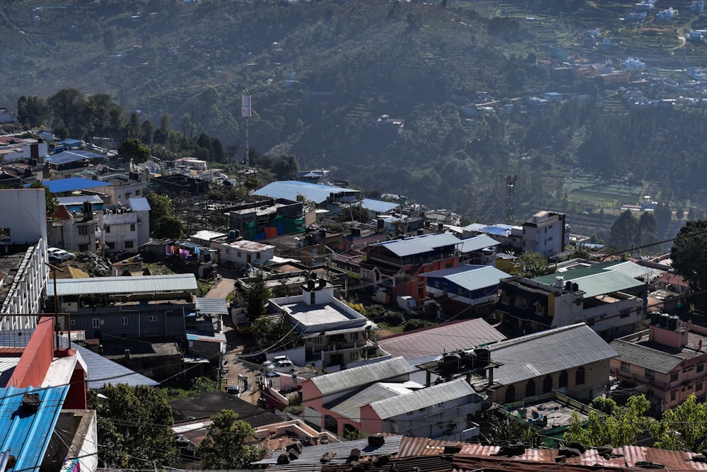 a small town with a mountain in the background