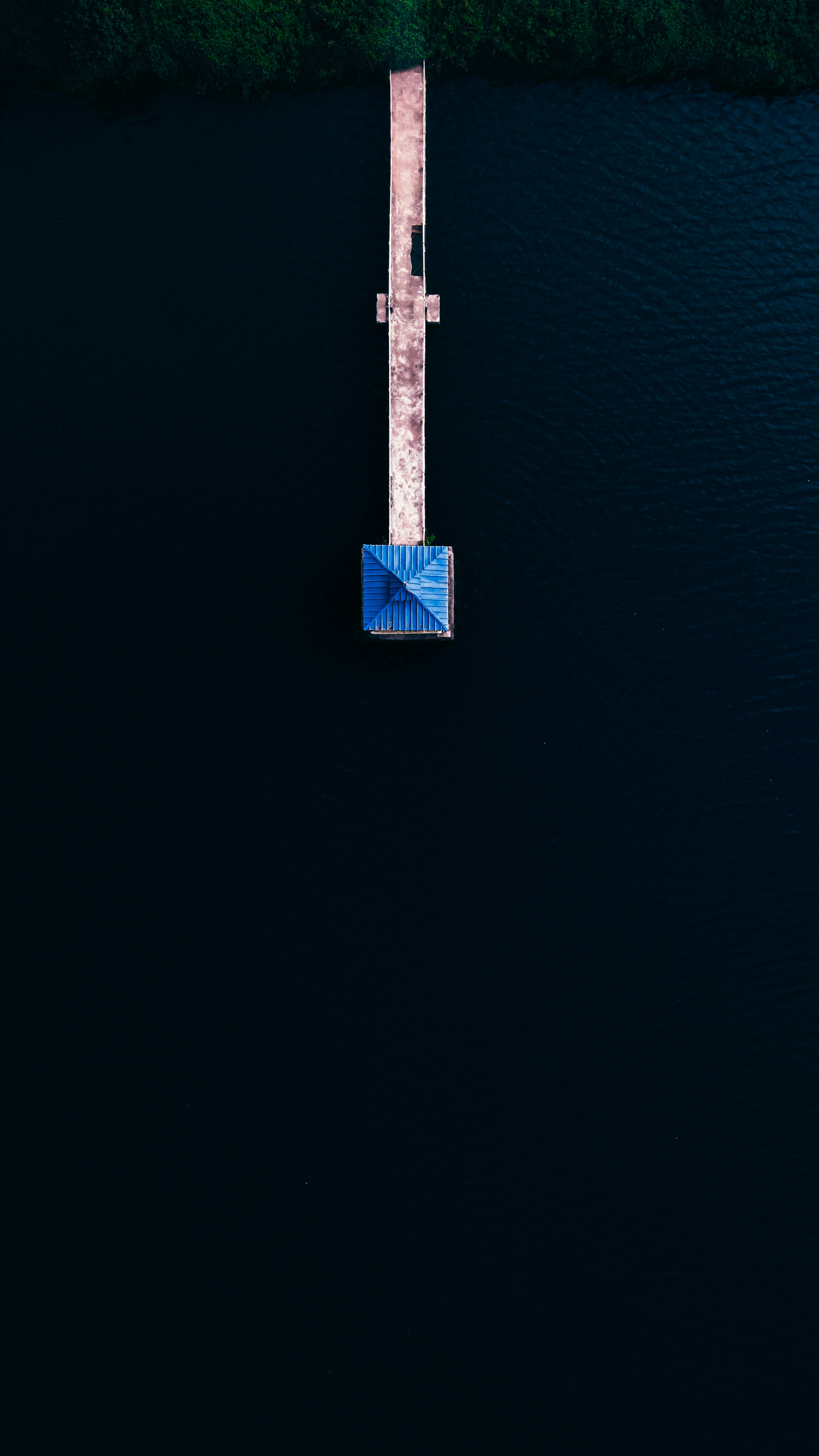 an aerial view of a boat in the water