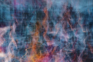An abstract composition of multicolored bars overlapping each other with glowing edges.