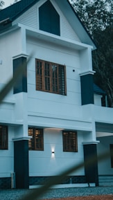 a large white house with a black roof