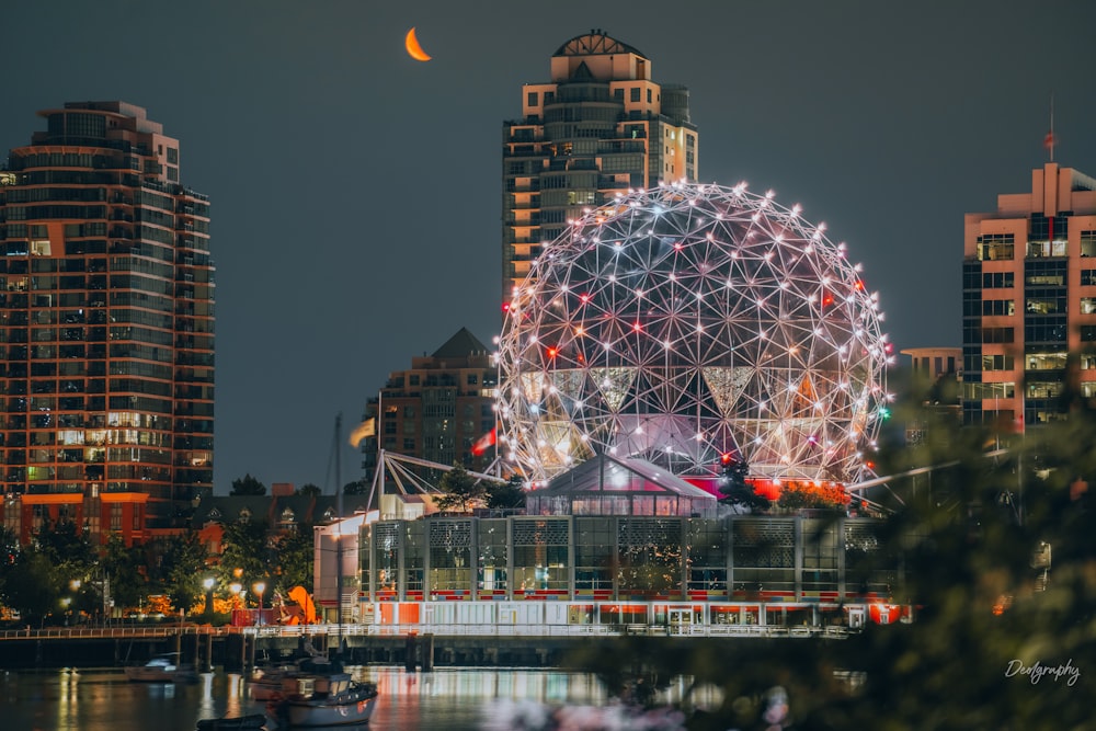 a ferris wheel lit up in the night sky