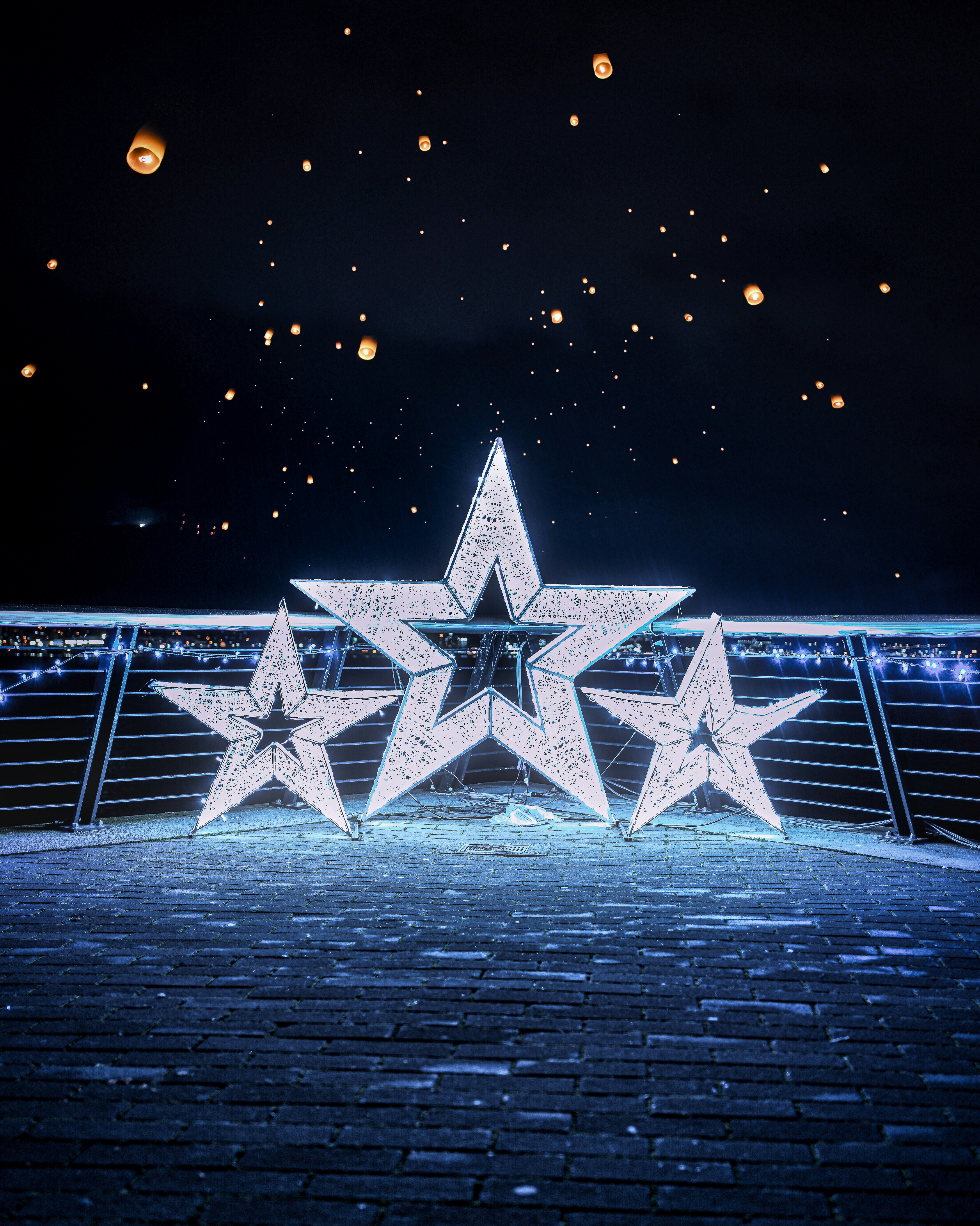 a large white star sitting on top of a brick floor