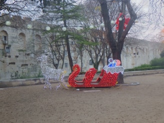Close-up of the sleigh’s colorful lights glowing warmly against the winter night.