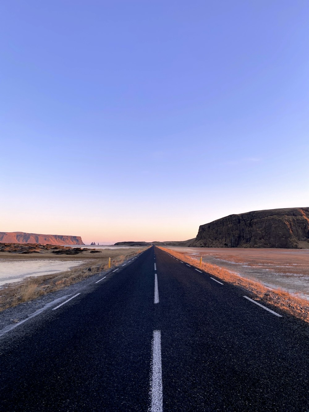 an empty road in the middle of nowhere