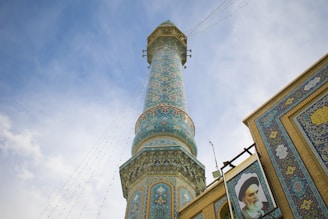 a tall tower with a clock on it's side